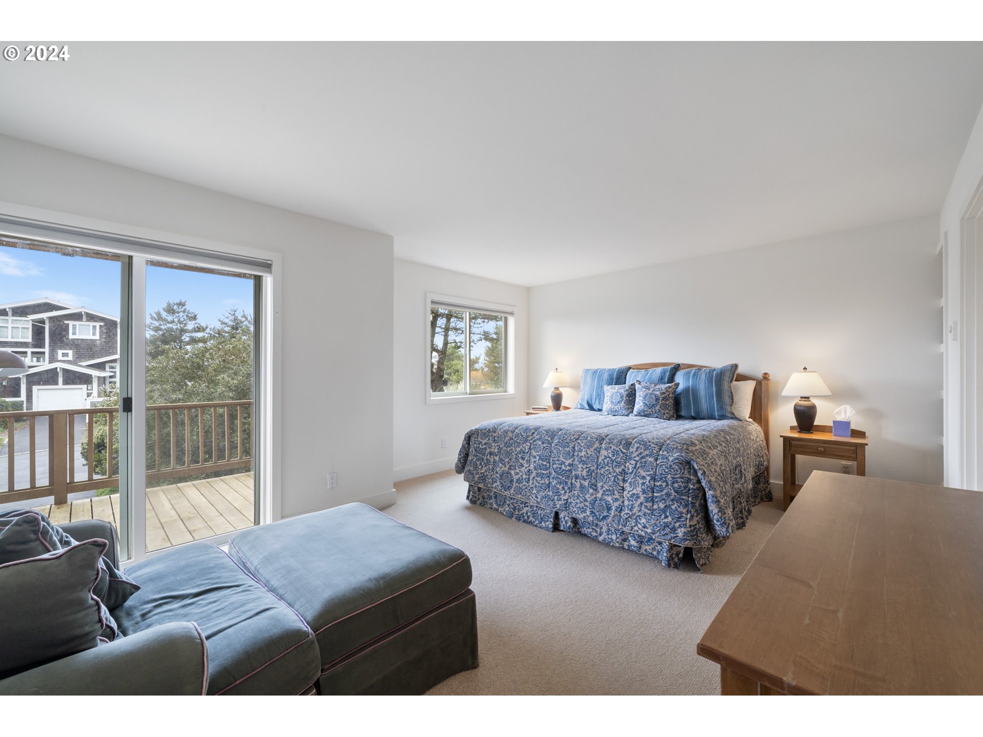 250 Capes Drive Oceanside, OR 97141 - Photo 23 of 38 a bedroom with two beds and next to a window
