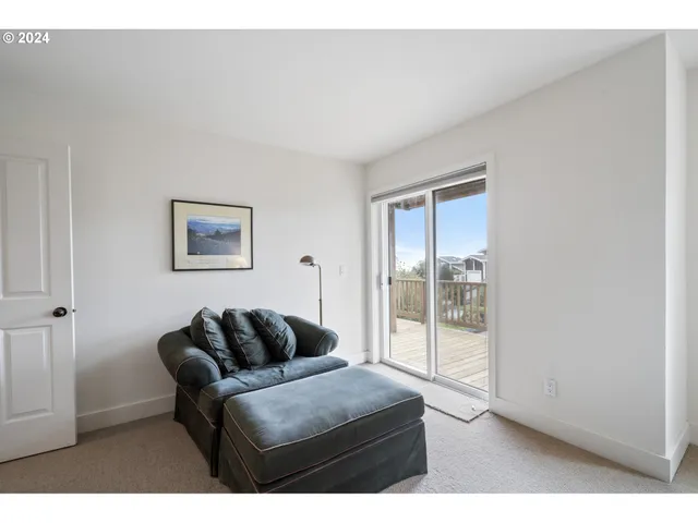 a living room with a bed and a couch