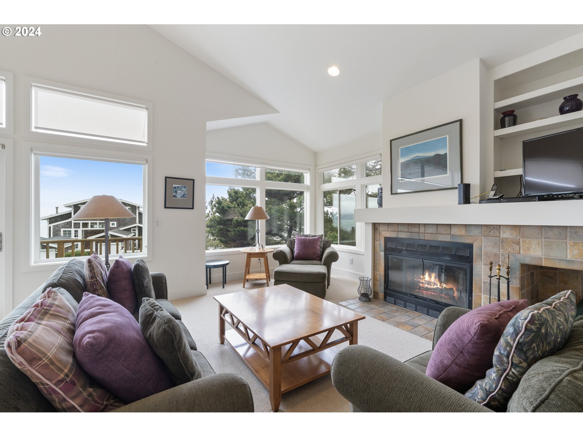 250 Capes Drive Oceanside, OR 97141 - Photo 4 of 38 a living room with furniture and a fireplace