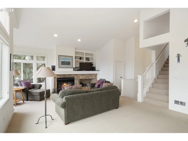 a kitchen with a sink a stove a dining table and chairs