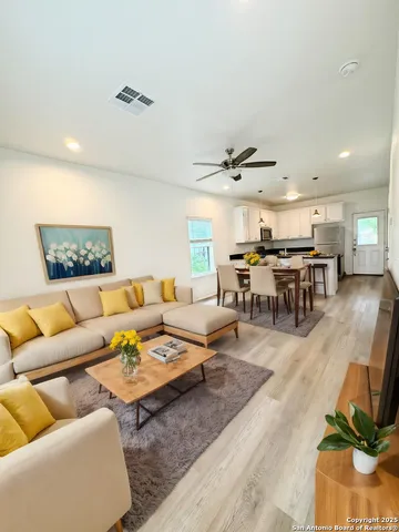 a living room with furniture and a table