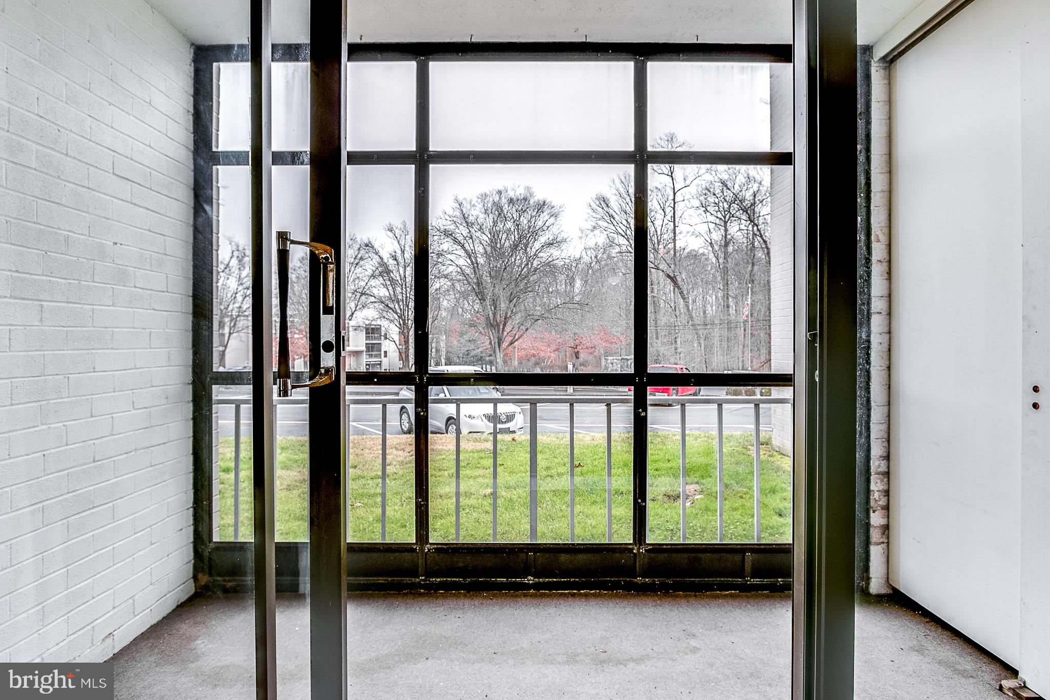 72 Welsh Tract Road, Unit 104 Newark, DE 19713 - Photo 14 of 19 View of Patio Through the Sliding Glass Doors