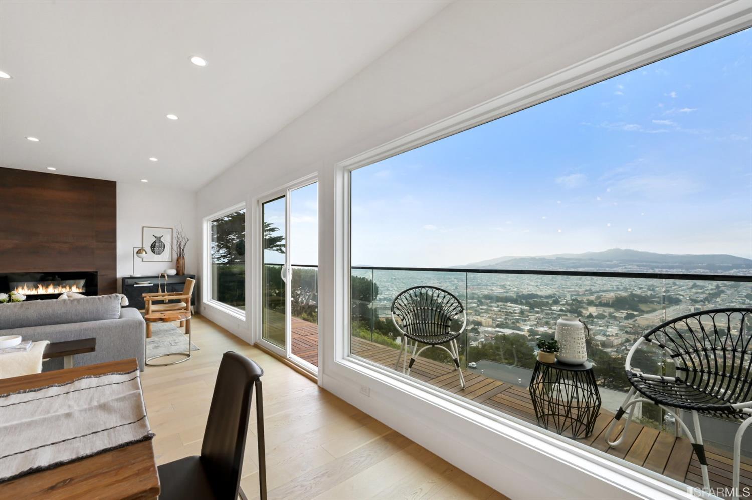 464 Lansdale Avenue San Francisco, CA 94127 - Photo 14 of 61 a living room with furniture a flat screen tv and a floor to ceiling window