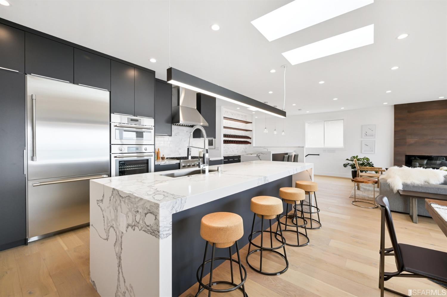 464 Lansdale Avenue San Francisco, CA 94127 - Photo 22 of 61 a kitchen with stainless steel appliances granite countertop a table chairs and a refrigerator