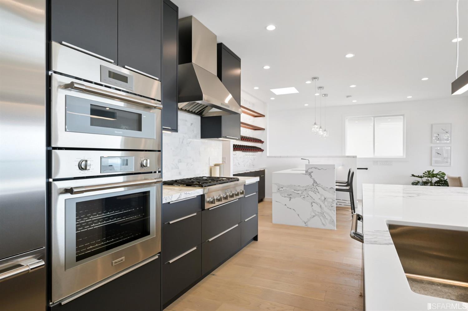 464 Lansdale Avenue San Francisco, CA 94127 - Photo 23 of 61 a kitchen with stainless steel appliances granite countertop a stove and a sink