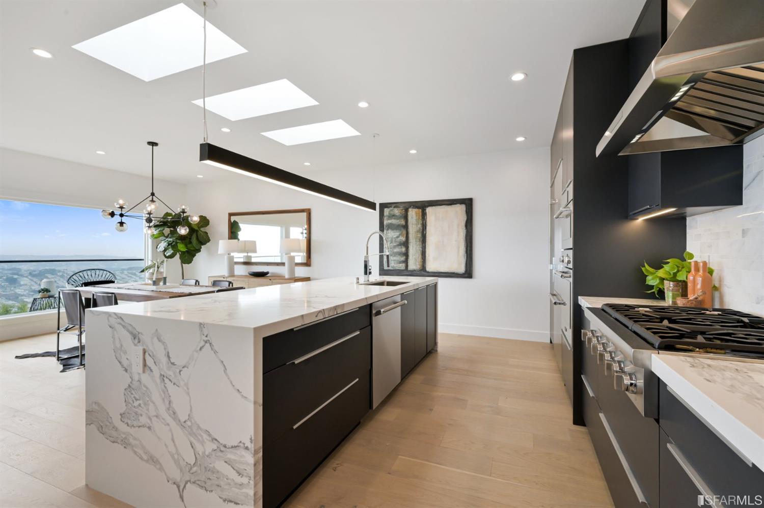 464 Lansdale Avenue San Francisco, CA 94127 - Photo 24 of 61 a kitchen with stainless steel appliances kitchen island granite countertop a sink and stove