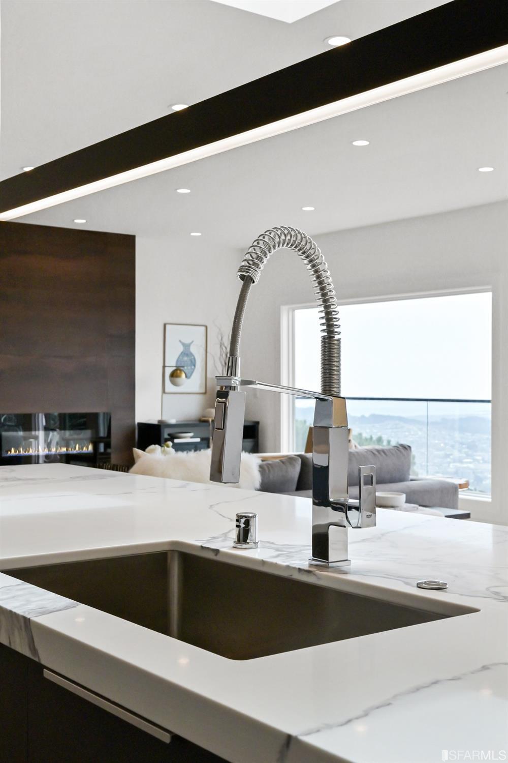 464 Lansdale Avenue San Francisco, CA 94127 - Photo 26 of 61 a kitchen with a faucet a sink and a stove with wooden floor
