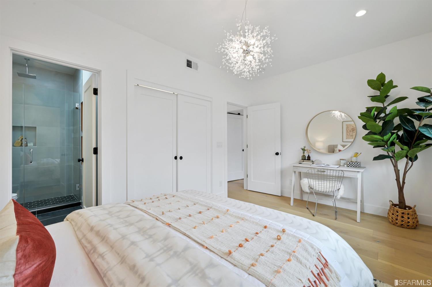 464 Lansdale Avenue San Francisco, CA 94127 - Photo 36 of 61 a bedroom with a bed and a chandelier