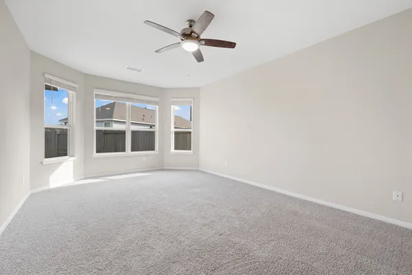 a view of an empty room with a window