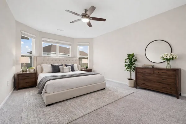 a bed room with bed and window