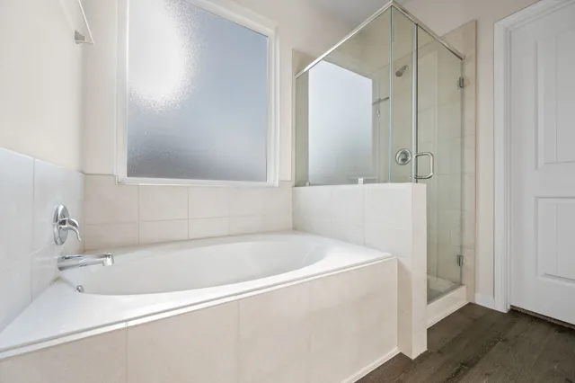 a white bath tub sitting in a bathroom