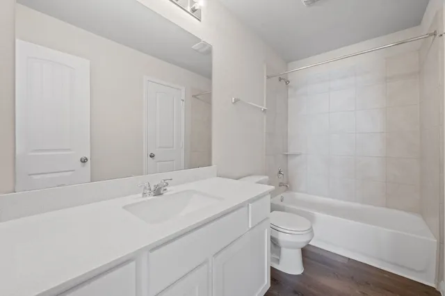a bathroom with a sink a toilet and a bathtub