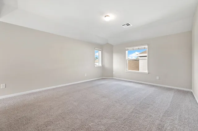 a view of empty room with windows