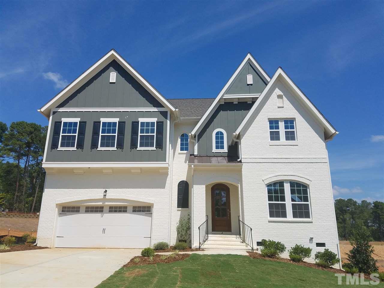5264 Aleppo Lane, Unit 51 Raleigh, NC 27613 - Photo 1 of 22 a front view of a house with a yard