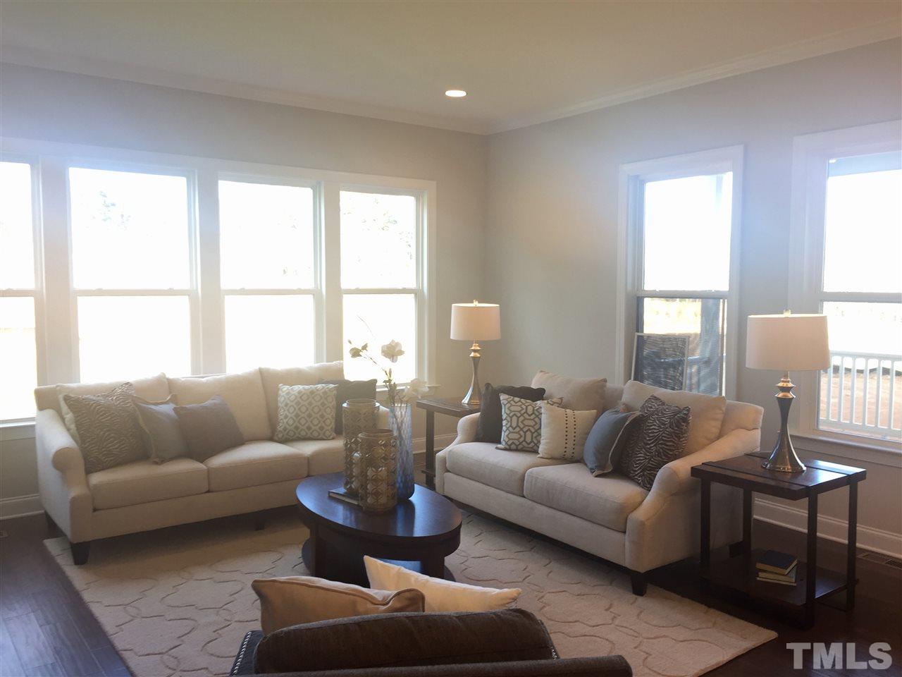 5264 Aleppo Lane, Unit 51 Raleigh, NC 27613 - Photo 12 of 22 a living room with furniture and a large window