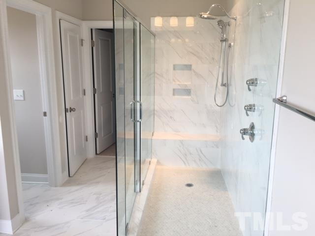 5264 Aleppo Lane, Unit 51 Raleigh, NC 27613 - Photo 15 of 22 a bathroom with a glass shower door