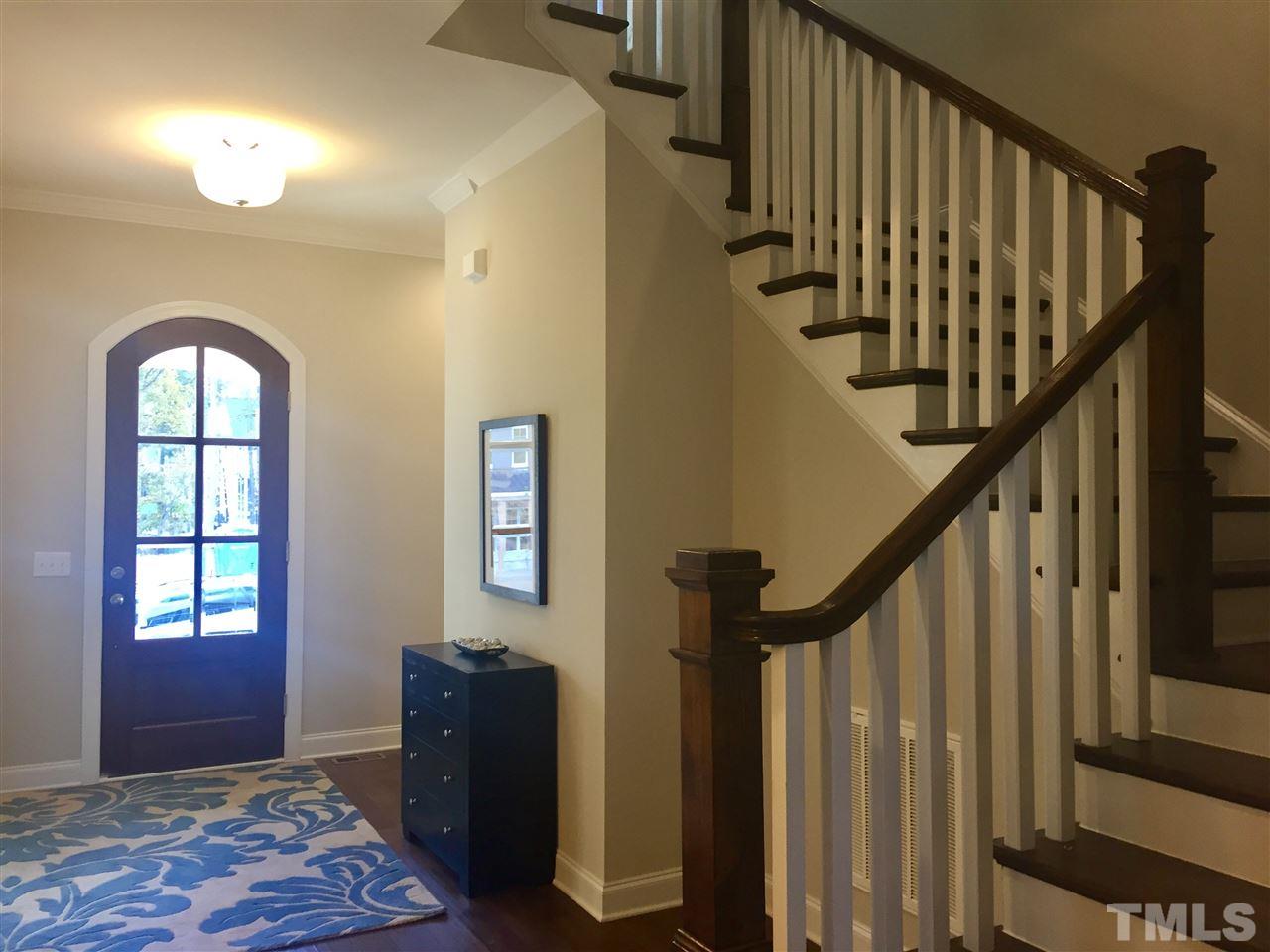 5264 Aleppo Lane, Unit 51 Raleigh, NC 27613 - Photo 3 of 22 a view of entryway with wooden floor and stairs