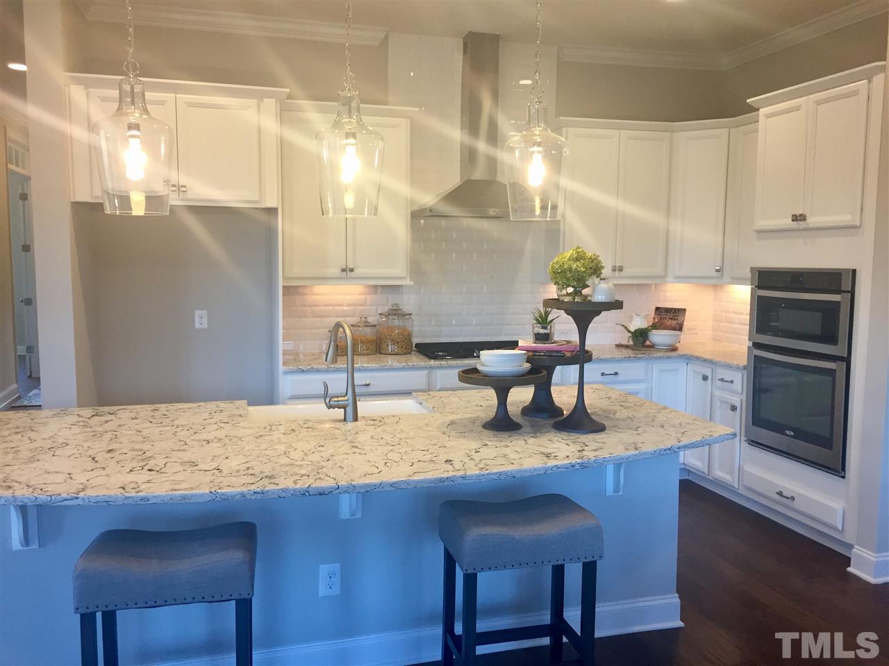 5264 Aleppo Lane, Unit 51 Raleigh, NC 27613 - Photo 6 of 22 a kitchen with granite countertop a sink a counter top space and appliances