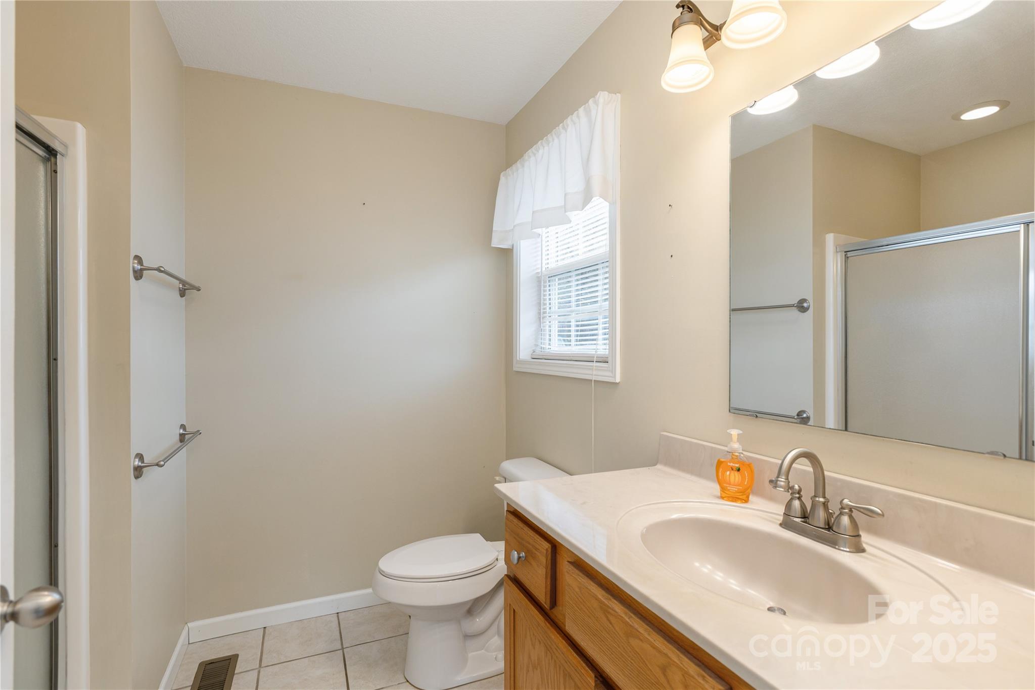 190 Temple Church Road Brevard, NC 28712 - Photo 16 of 24 a bathroom with a sink toilet vanity and shower