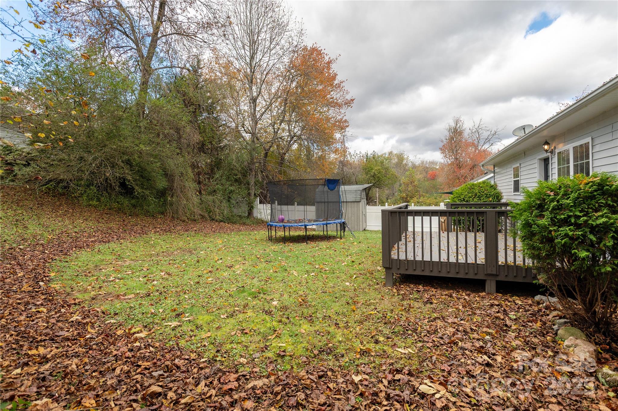 190 Temple Church Road Brevard, NC 28712 - Photo 21 of 24 a view of a house with backyard and deck