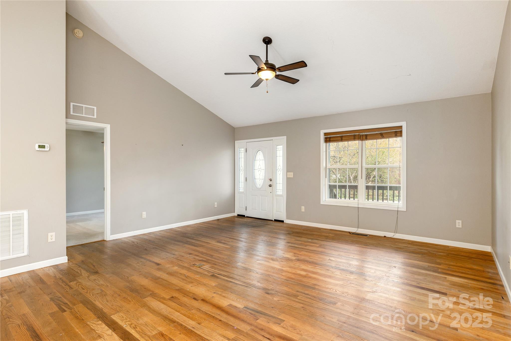 190 Temple Church Road Brevard, NC 28712 - Photo 5 of 24 a view of empty room with wooden floor and fan