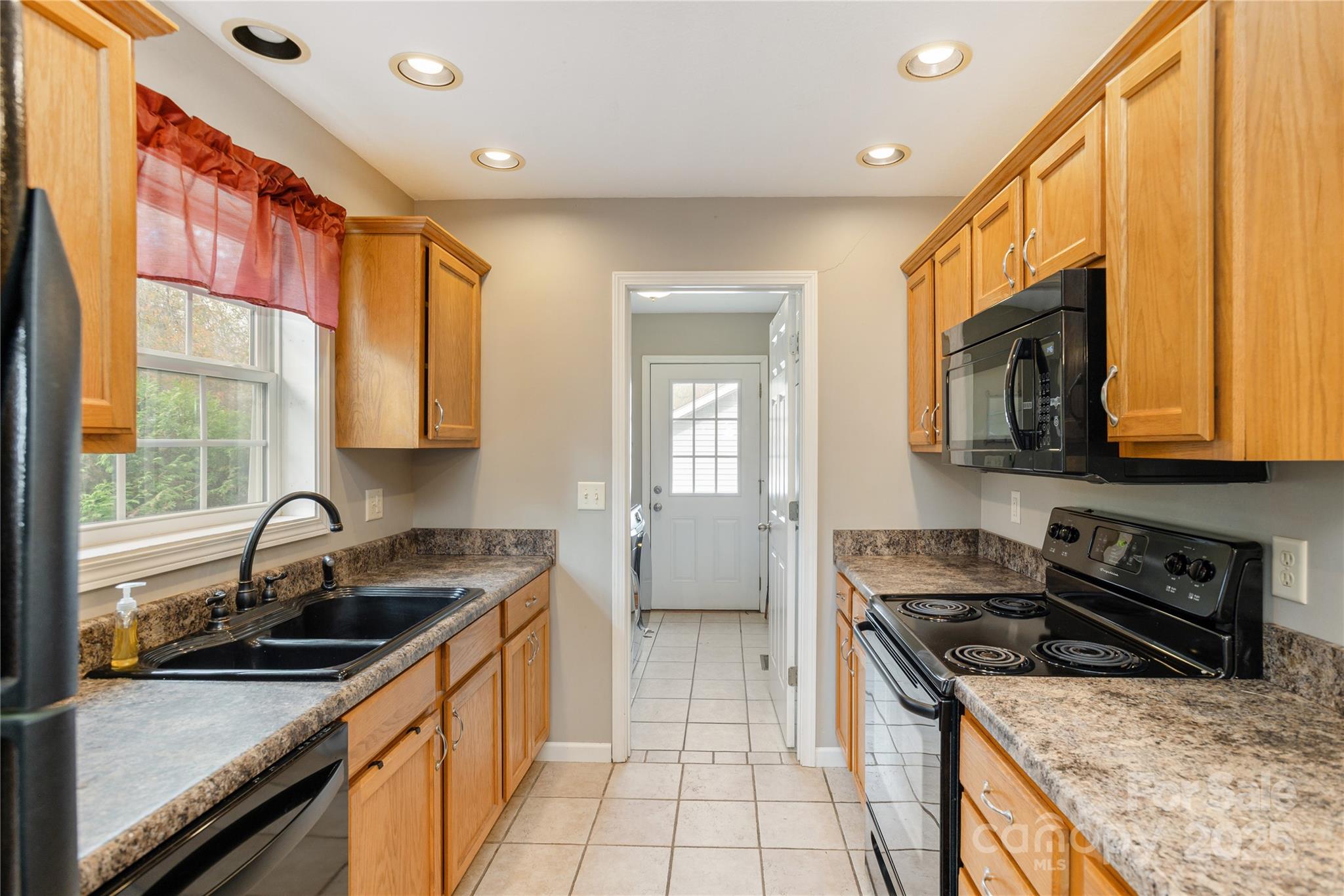 190 Temple Church Road Brevard, NC 28712 - Photo 7 of 24 a kitchen that has a sink and a stove