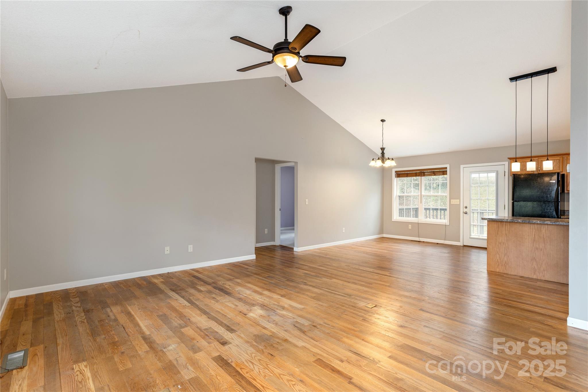 190 Temple Church Road Brevard, NC 28712 - Photo 10 of 24 a view of an empty room with window and wooden floor