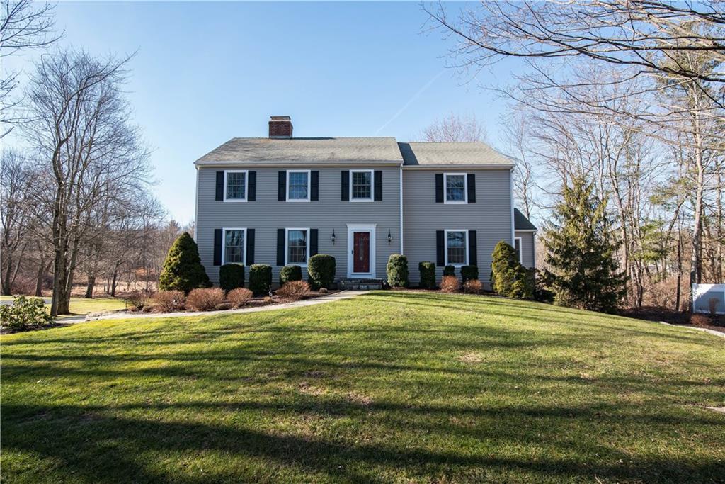 7 East Ridge Road Ridgefield, CT 06877 - Photo 1 of 1 a front view of a house with a yard