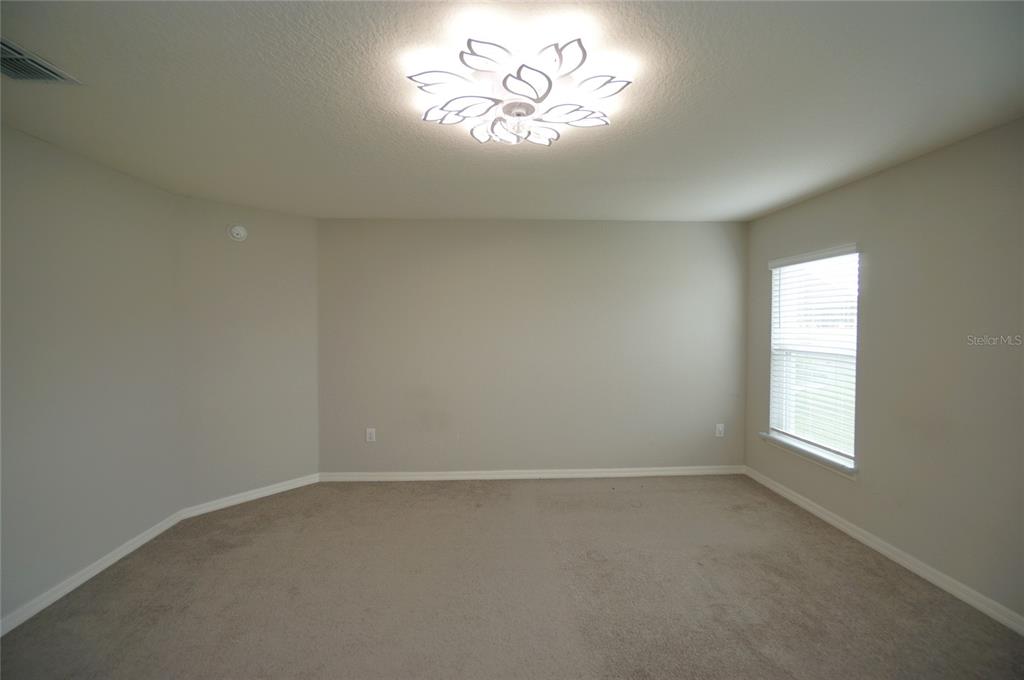 12221 Cypress Br Street Riverview, FL 33579 - Photo 15 of 20 an empty room with a window