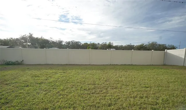 an aerial view of ocean with houses