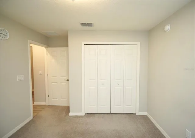 an empty room with white door
