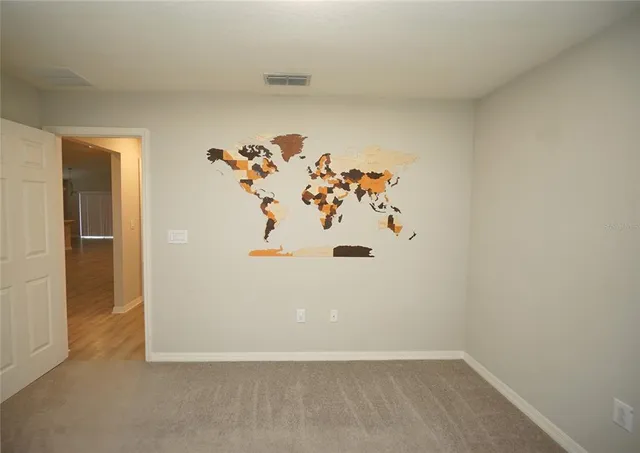 an white room with a refrigerator