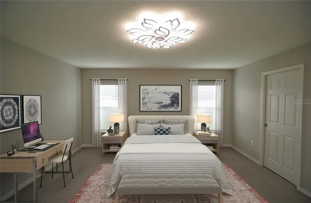 a bedroom with a bed and furniture with window