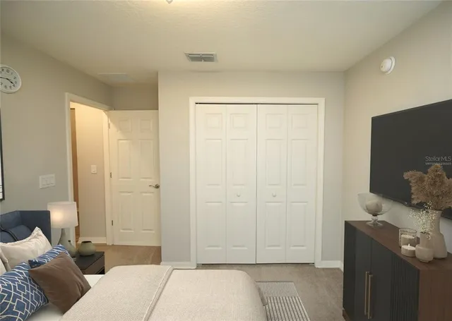 a bedroom with a bed and furniture