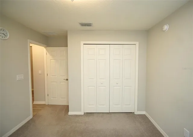 an empty room with white door