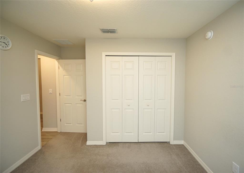 12221 Cypress Br Street Riverview, FL 33579 - Photo 10 of 20 an empty room with white door