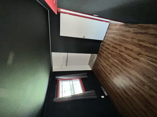 a living room with stainless steel appliances kitchen island granite countertop furniture and a kitchen view