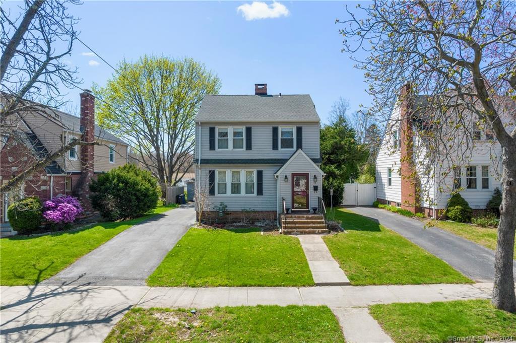 59 Sound View Terrace New Haven, CT 06512 - Photo 1 of 1 a front view of a house with a yard