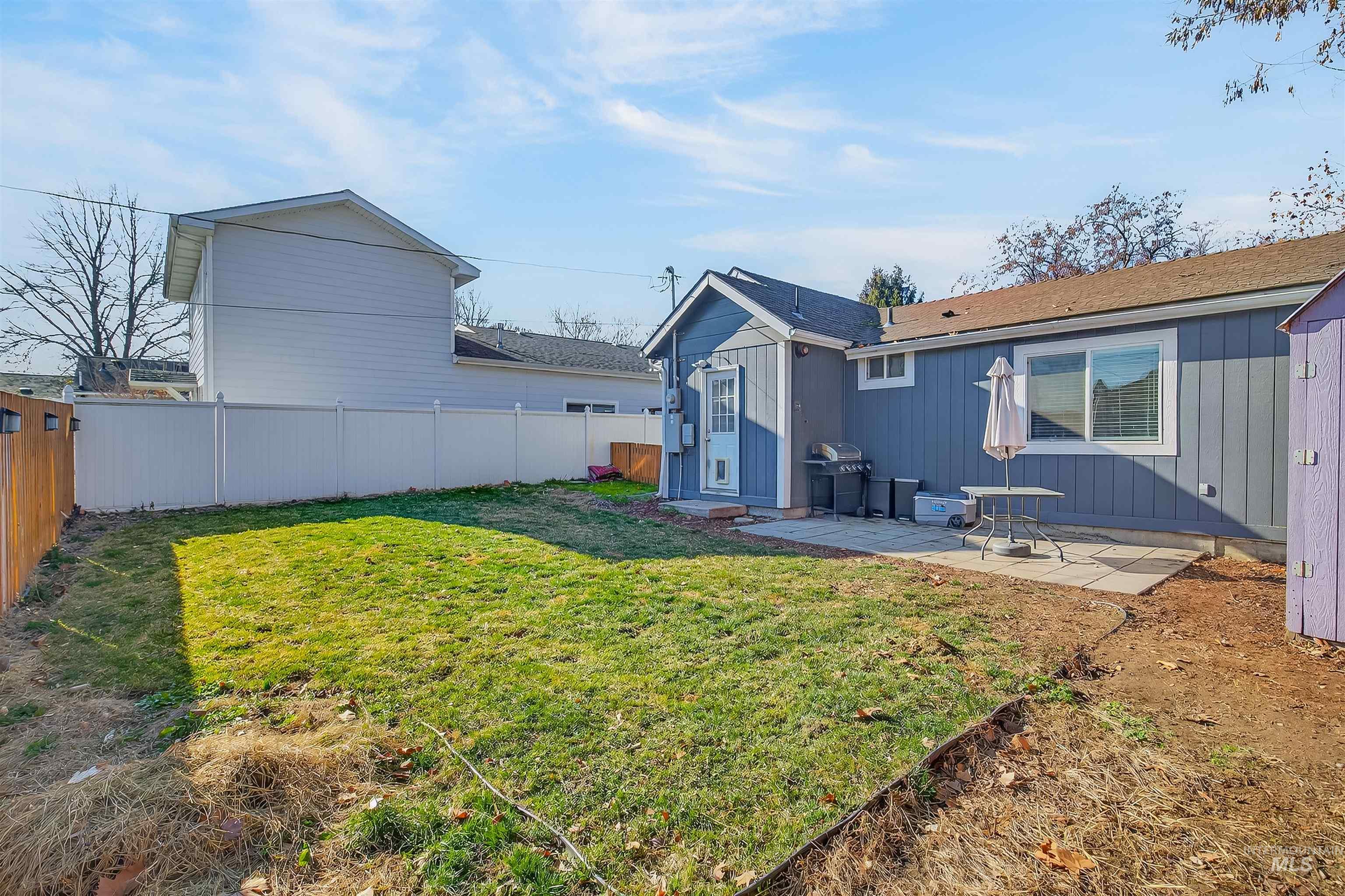 807 3rd Street Clarkston, WA 99403 - Photo 27 of 33 Back of property with a patio and a fenced backyard