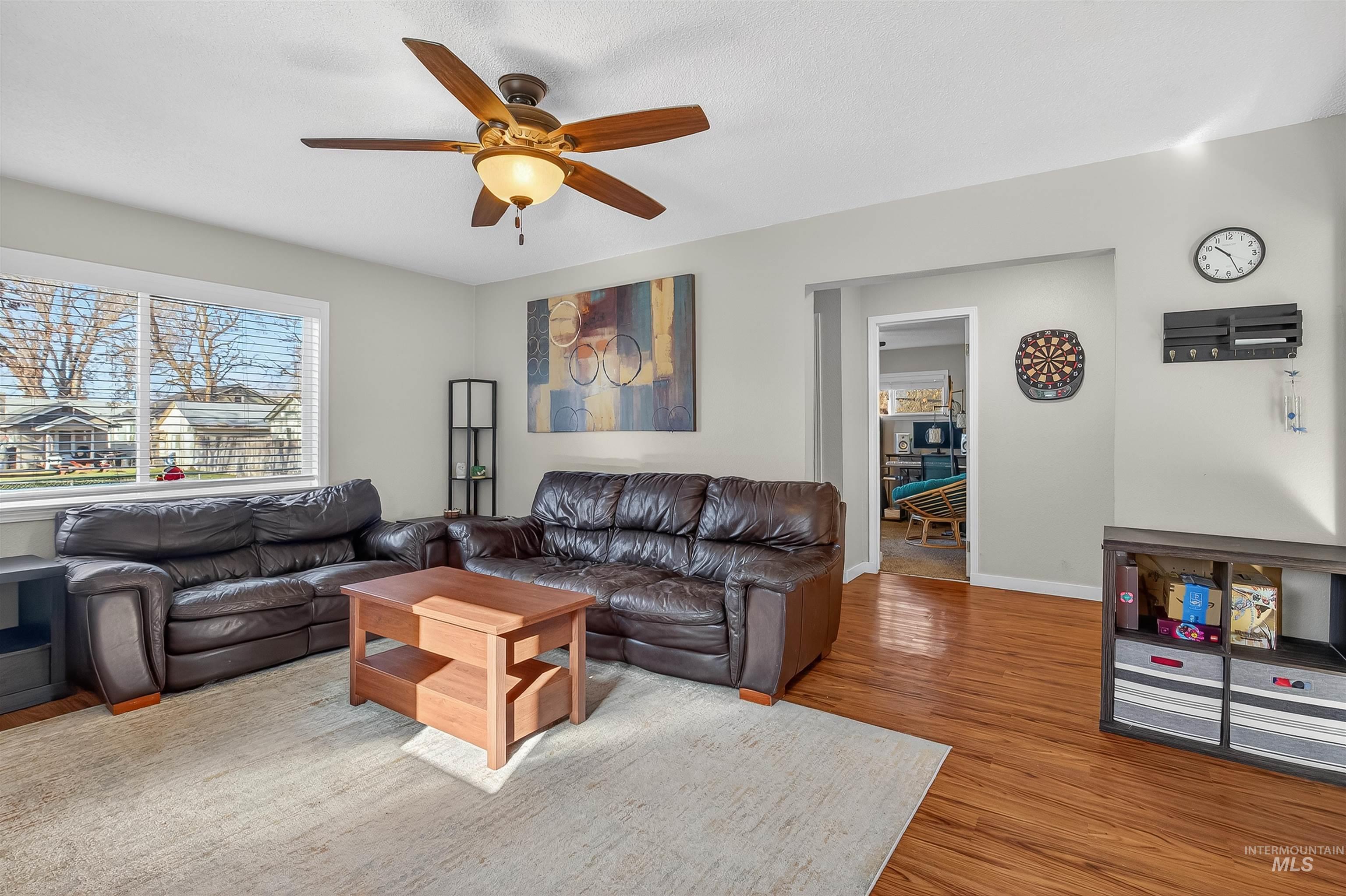 807 3rd Street Clarkston, WA 99403 - Photo 10 of 33 Living room featuring wood finished floors and ceiling fan
