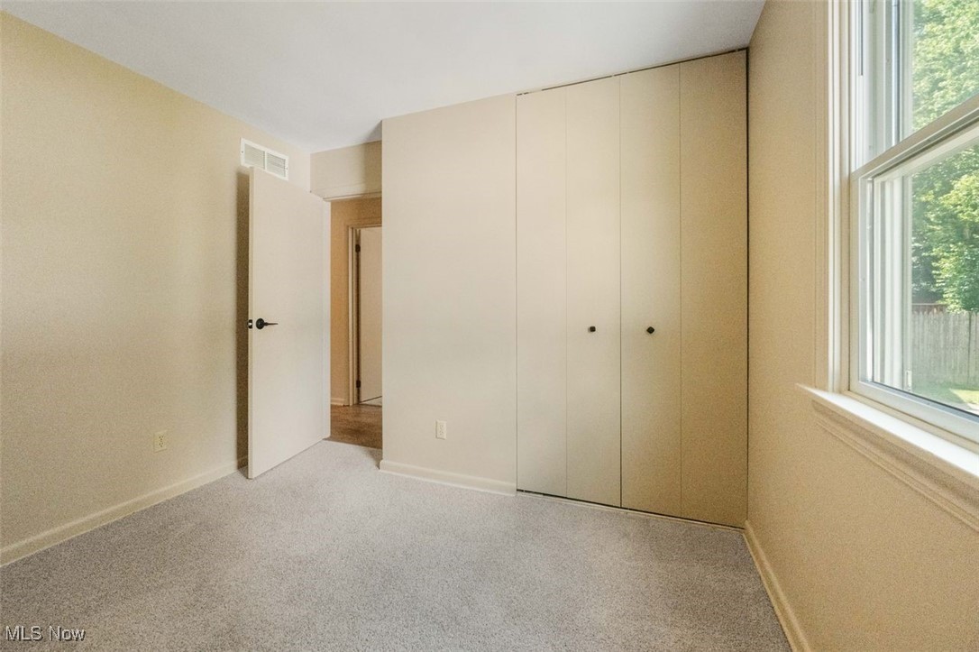 1586 Norledge Road Akron, OH 44305 - Photo 16 of 24 Unfurnished bedroom with multiple windows and carpet floors