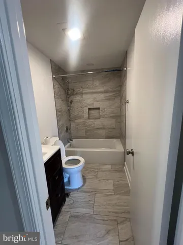 a bathroom with a sink and a shower