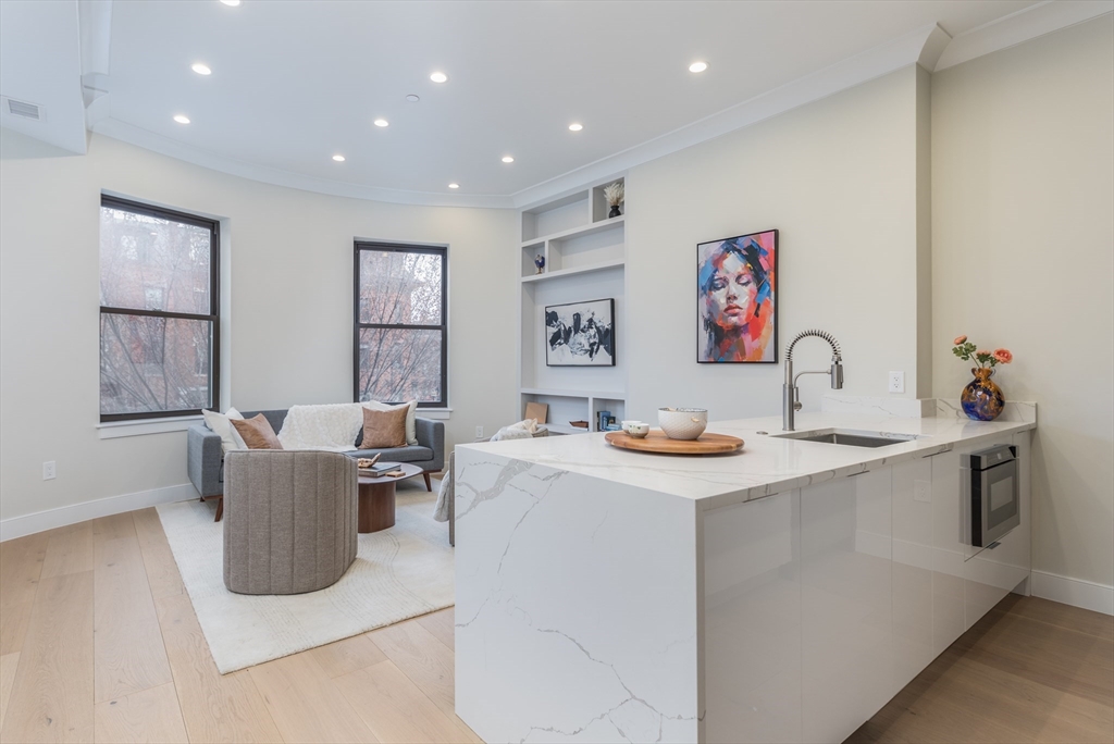 577 Massachusetts Avenue, Unit C Boston, MA 02118 - Photo 4 of 12 a living room with furniture and window