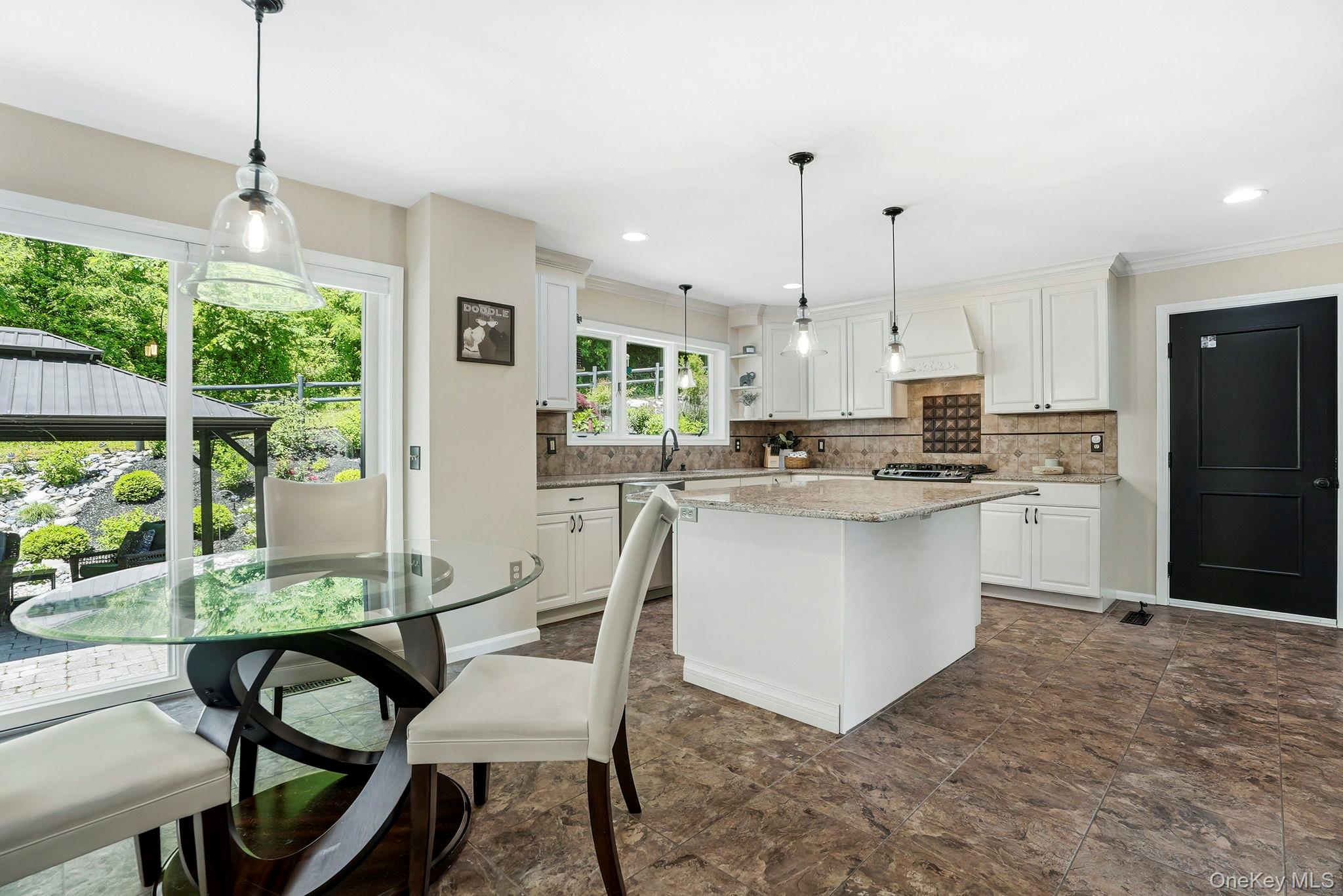 31 Ridge Road Cortlandt Manor, NY 10567 - Photo 12 of 39 This chef's kitchen includes space for seating at the island too.