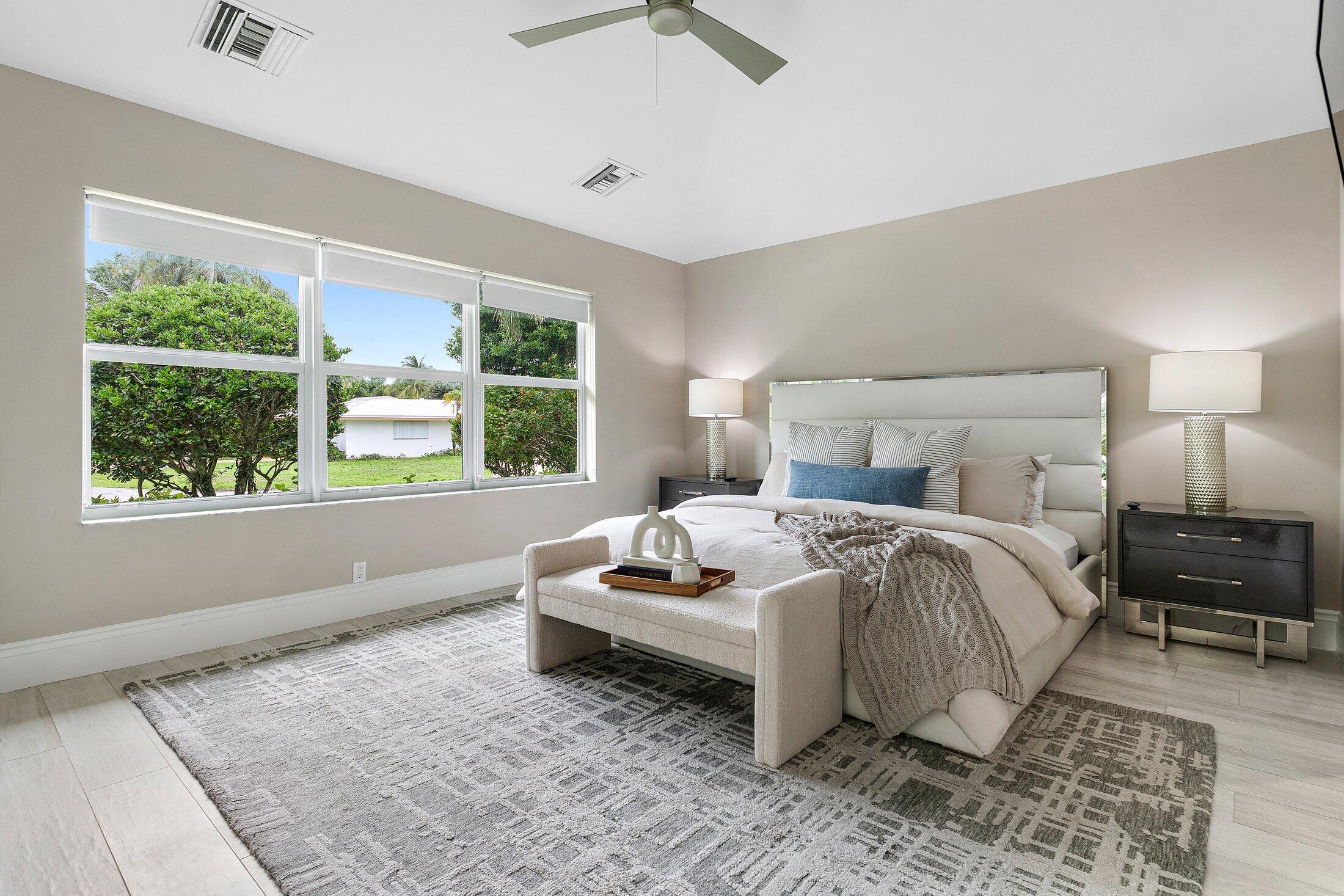 1400 Lake Drive Delray Beach, FL 33444 - Photo 103 of 121 a bedroom with a bed and window