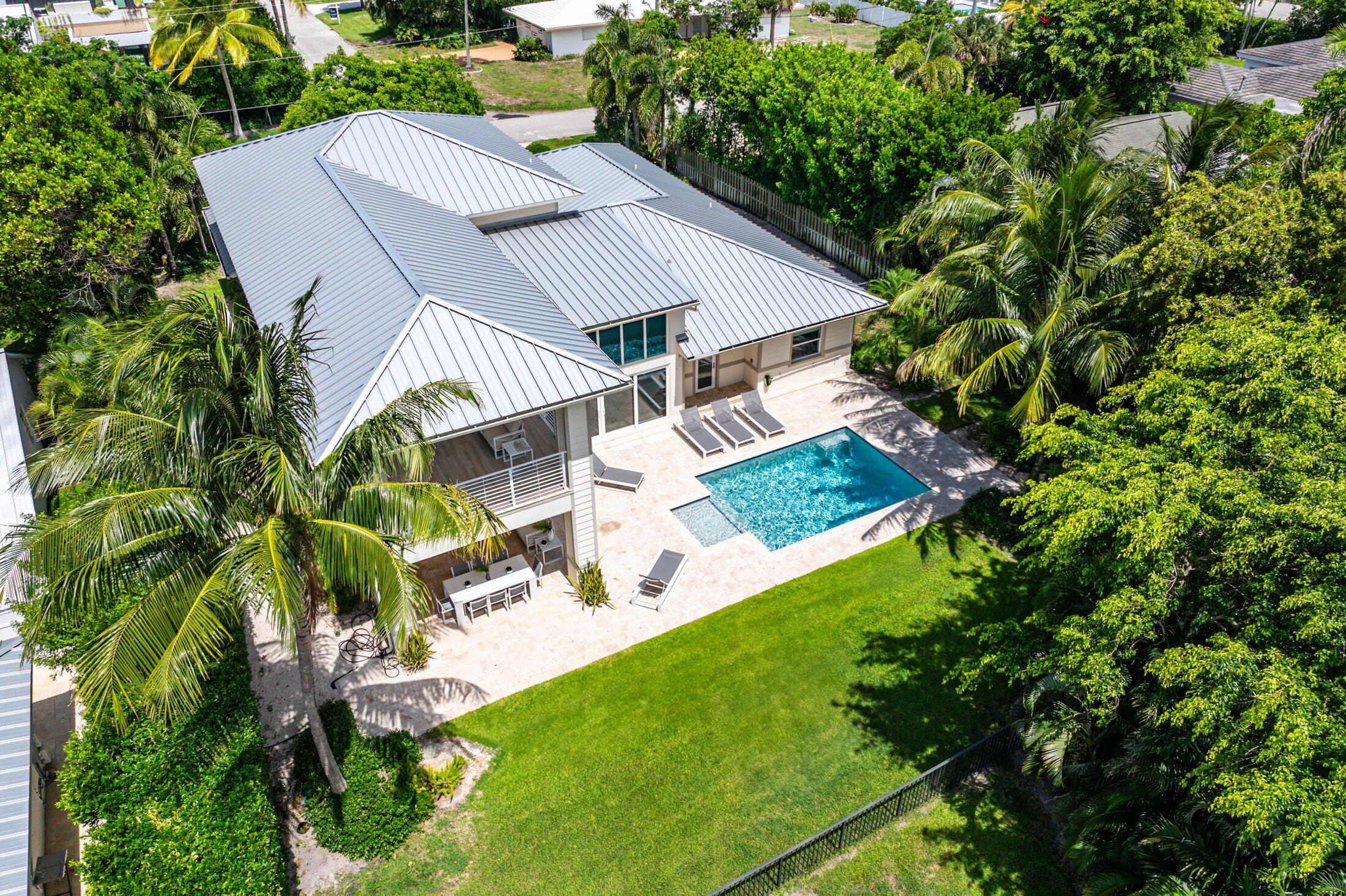 1400 Lake Drive Delray Beach, FL 33444 - Photo 92 of 121 an aerial view of a house with garden