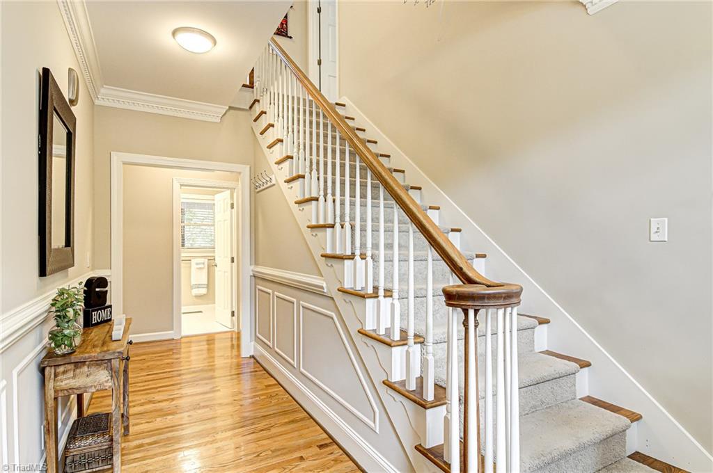 3835 Edgewater Street High Point, NC 27265 - Photo 2 of 30 As you enter the home you will loved the classic yet updated amenities of the home. Crown molding in most of the rooms of this home. Picture frame wainscoting and chair rail are also in the foyer and formal dining room.