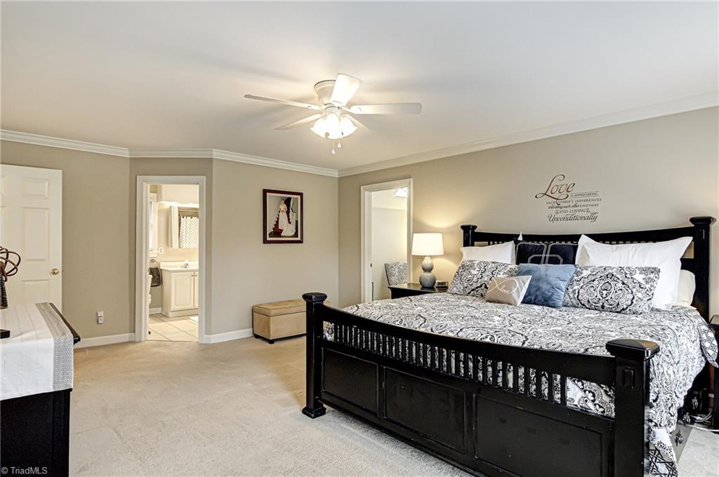 3835 Edgewater Street High Point, NC 27265 - Photo 13 of 30 The master suite has an attached sitting room with walk-in closet, master bath with a jetted tub and separate tiled shower. There is an additional closet in the master bedroom as well to give added closet space