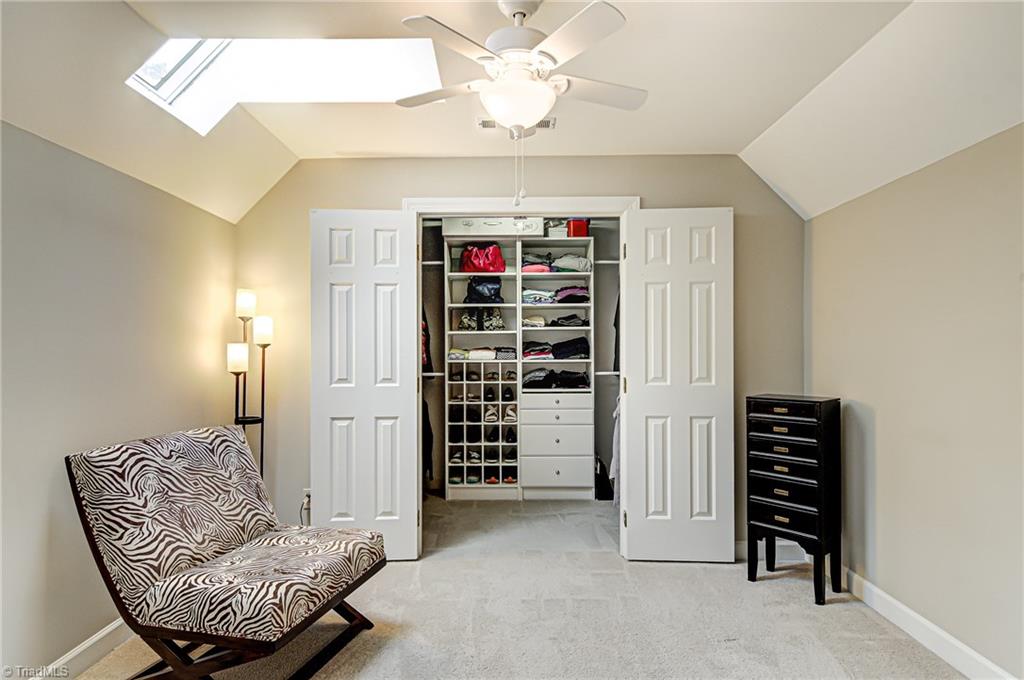 3835 Edgewater Street High Point, NC 27265 - Photo 14 of 30 This sitting room attached to the master is an awesome space to get away too. It has a skylight to provide natural light. The master closet is a great size with built-in shelving. There is also another closet within the master bedroom to give you excellent closet space.