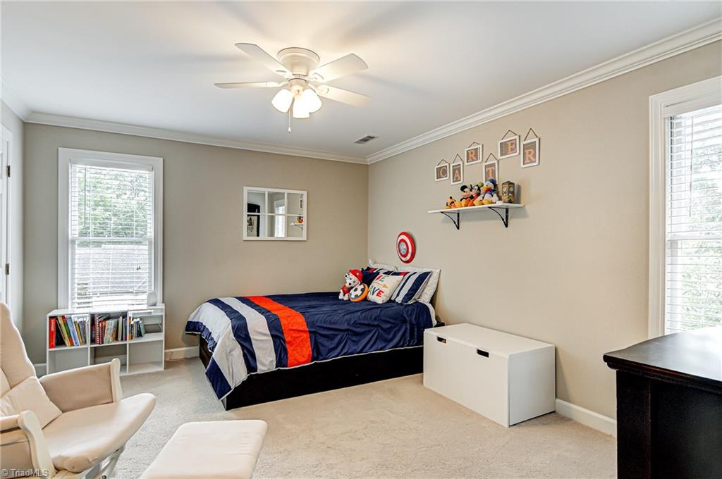 3835 Edgewater Street High Point, NC 27265 - Photo 18 of 30 Bedroom three has carpet, crown molding and good closet space.